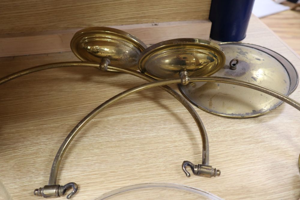 Two glass hurricane ceiling lamps